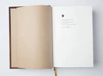 The leather-bound book "The Road of Transformations" by D.Rumi