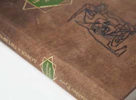 The leather-bound book "The Road of Transformations" by D.Rumi
