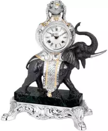 A table clock on a marble stand with an elephant