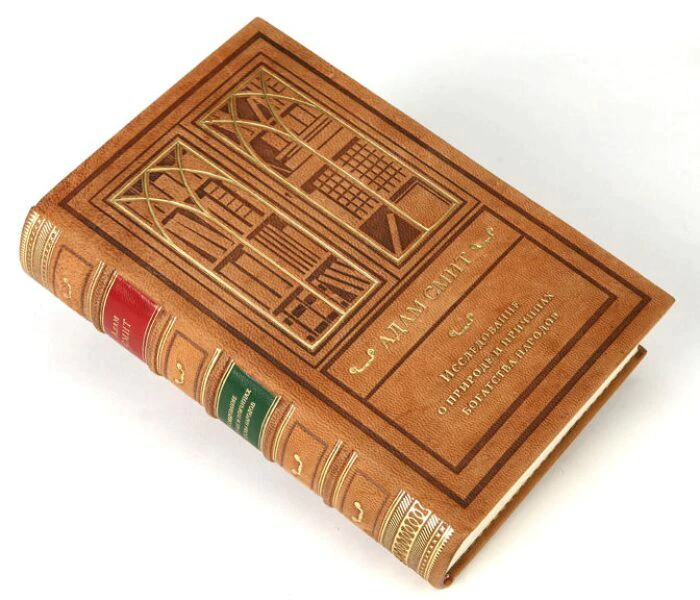The leather-bound book "A study on the nature and causes of the wealth of nations" by A.Smith