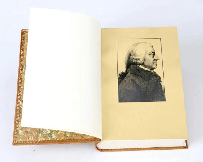 The leather-bound book "A study on the nature and causes of the wealth of nations" by A.Smith