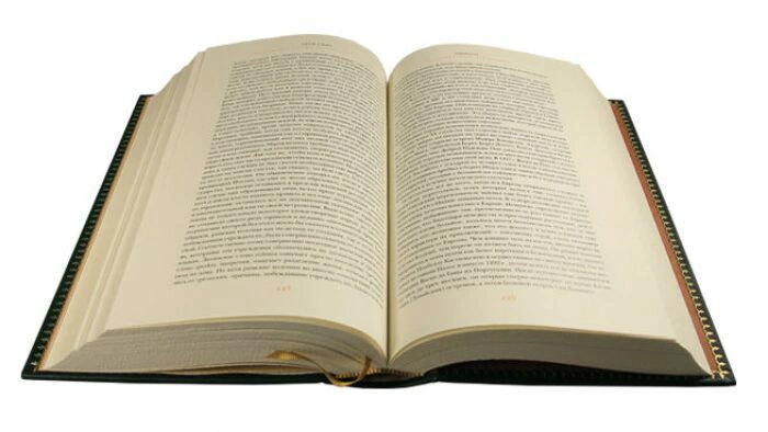 The leather-bound book "A Study on the nature and causes of the Wealth of Nations" by Adam Smith