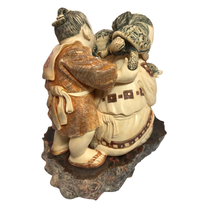 Souvenir from a mammoth tusk "Father and son with turtles"
