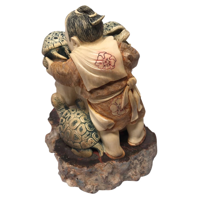 Souvenir from a mammoth tusk "Father and son with turtles"