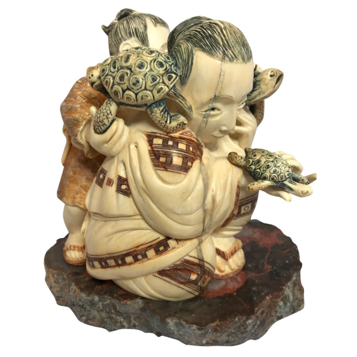 Souvenir from a mammoth tusk "Father and son with turtles"