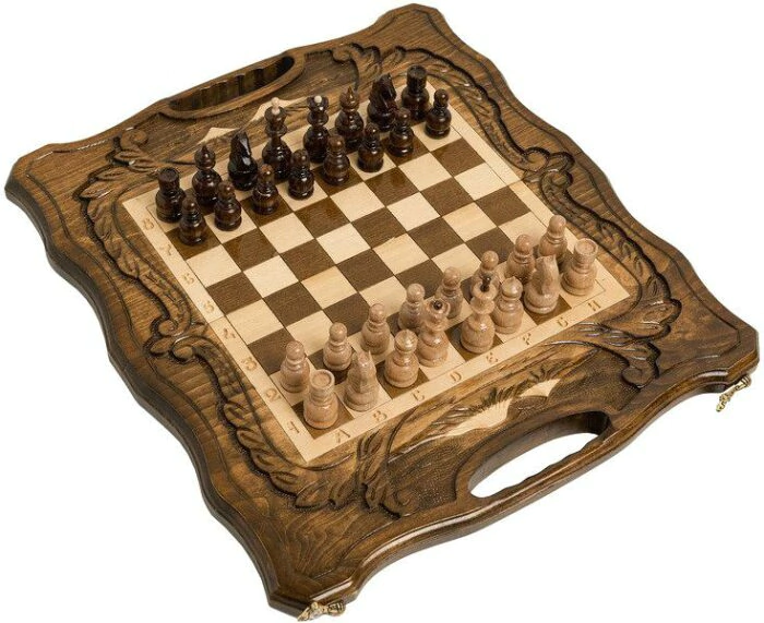 A small carved "Mountain Peaks" game set (chess, backgammon and checkers) with a handle