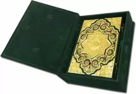Koran with filigree (gold), casting and garnets in a suede casket