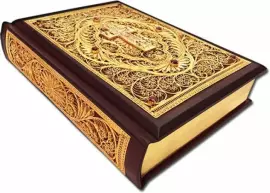 The Bible is large with casting and filigree (gold)