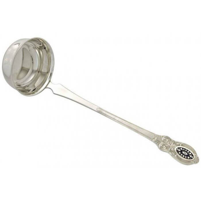 The spoon for pouring soup is silver