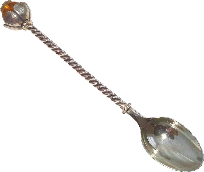 Silver tea spoon with amber