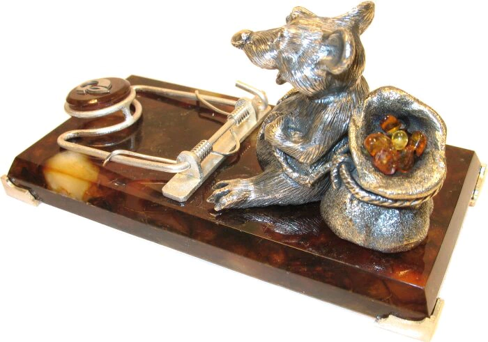 A business card holder made of amber "The Owner"