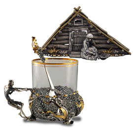 Collection of silver "Goldfish" with cup holder, spoon and napkin holder