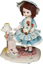 Statuette "A doll standing with a bear at the bedside table"