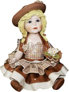 Statuette "Doll sitting in a holy brown dress"