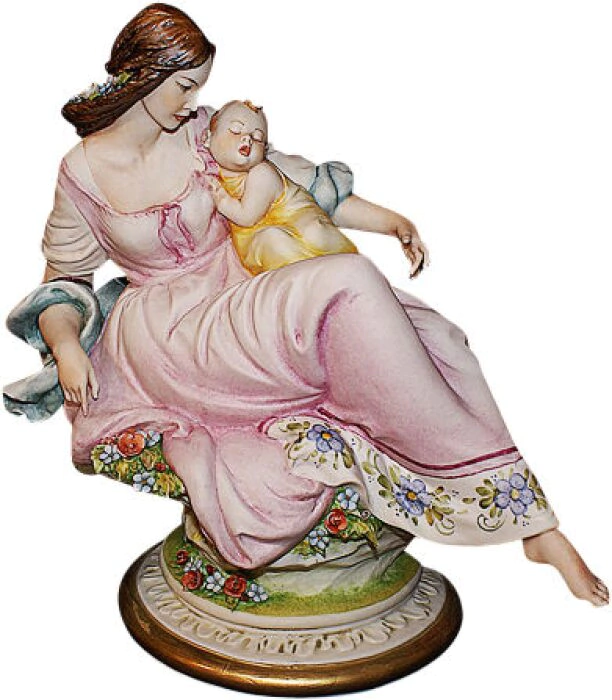 The statuette "Mother with child" is multicolored