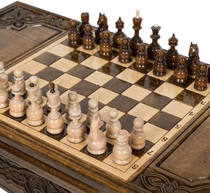 A chess table made of beech "Patterned" carved, with chess and backgammon