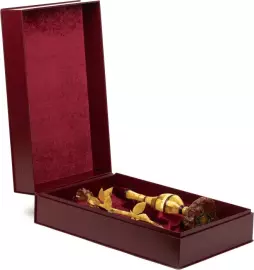 An amber rose in a vase