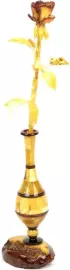An amber rose in a vase