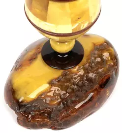 An amber rose in a vase