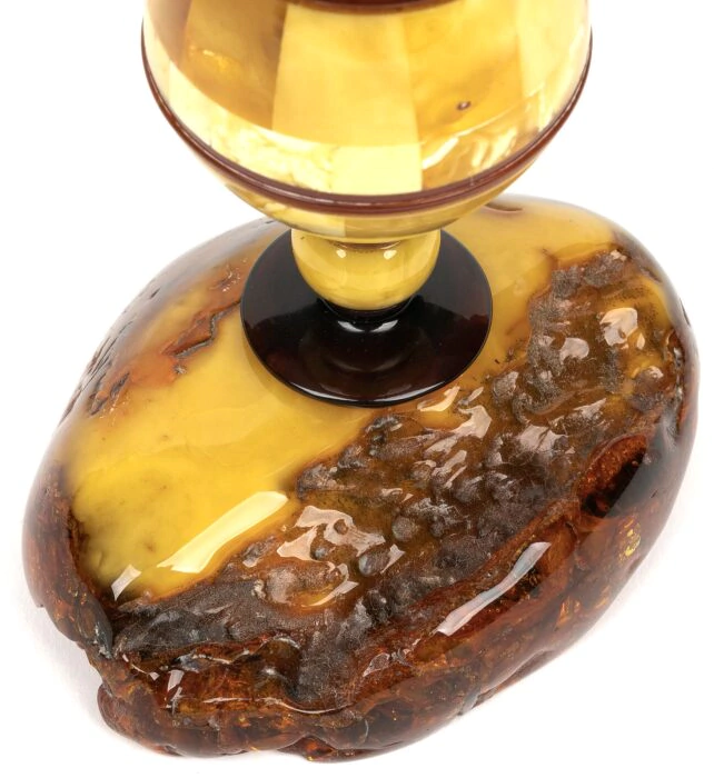 An amber rose in a vase