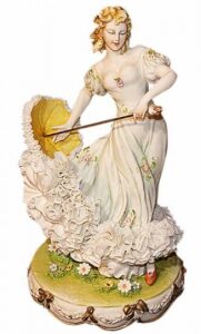 The statuette "Lady with an umbrella" is multicolored