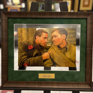 A photo from the movie "The Enemy at the gate" with an autograph by actor Judy Lowe