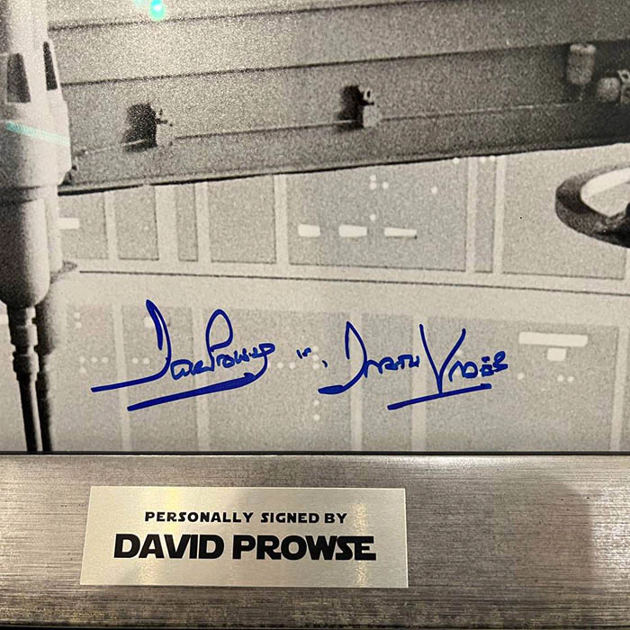 A photo with an autographed hatch by actor David Prose