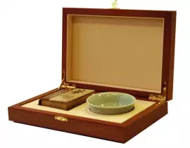 A gift set of a miniature book by Okakura Kakuzo "The Book of Tea" and a porcelain bowl "Chrysanthemum" in a box