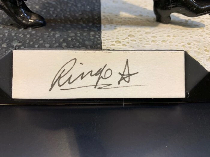 An autographed collectible statuette by musician Ringo Starr