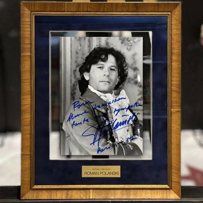 An autographed photo of film director Roman Polanski