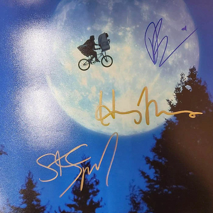 Autographed photo of actors Thomas Henry, Drew Barrymore and film director Steven Spielberg