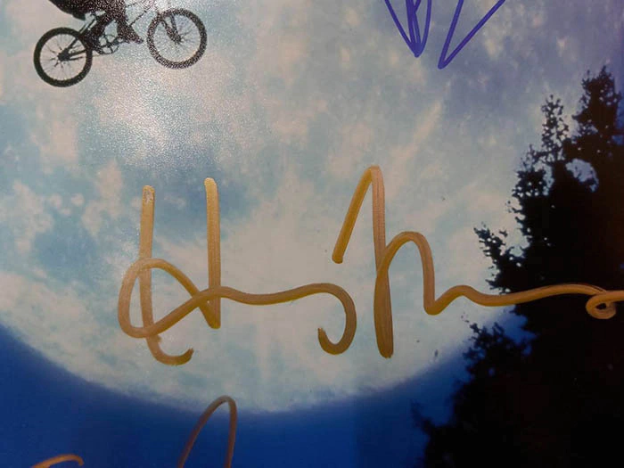 Autographed photo of actors Thomas Henry, Drew Barrymore and film director Steven Spielberg