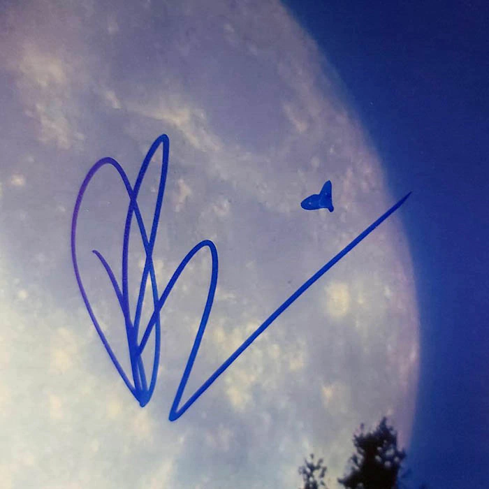 Autographed photo of actors Thomas Henry, Drew Barrymore and film director Steven Spielberg