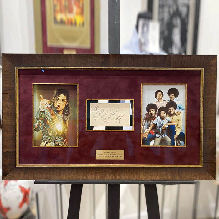 Autographed card of singers: Michael Jackson, Marlon Jackson, Tito Jackson, Jackie Jackson