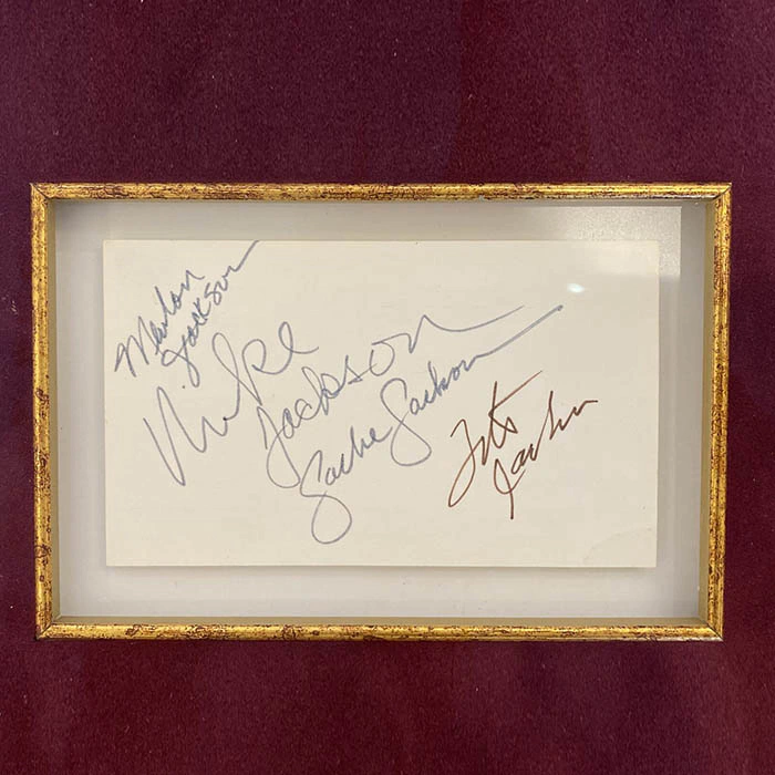 Autographed card of singers: Michael Jackson, Marlon Jackson, Tito Jackson, Jackie Jackson