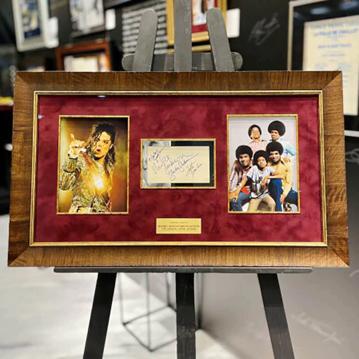 Autographed card of singers: Michael Jackson, Marlon Jackson, Tito Jackson, Jackie Jackson
