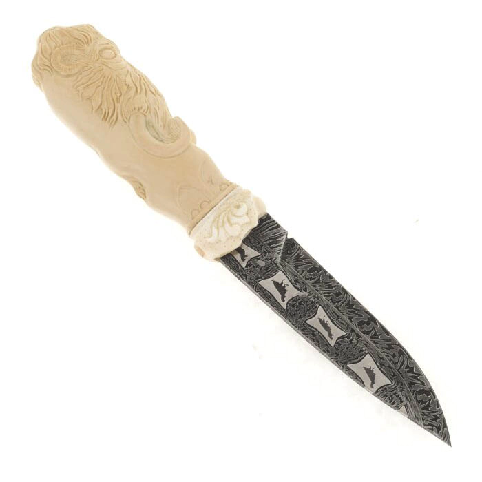 Souvenir of the mammoth tusk "Ice Age" with a knife