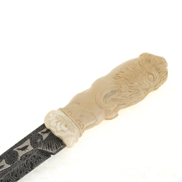 Souvenir of the mammoth tusk "Ice Age" with a knife