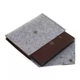 A leather-bound book by Robert T. Kiyosaki. Rich Dad, Poor Dad" (Cheprak Style)