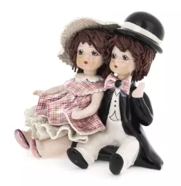 Statuette "A girl and a boy sitting"