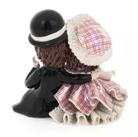 Statuette "A girl and a boy sitting"