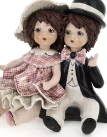 Statuette "A girl and a boy sitting"