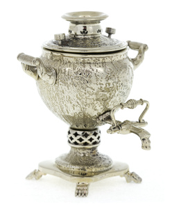 A set of mini samovars made of nickel silver in a wooden box