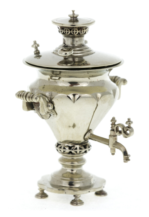 A set of mini samovars made of nickel silver in a wooden box
