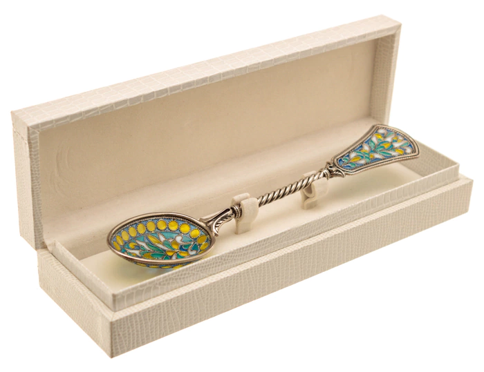 A teaspoon of "The Seasons. Spring" with stained glass enamels