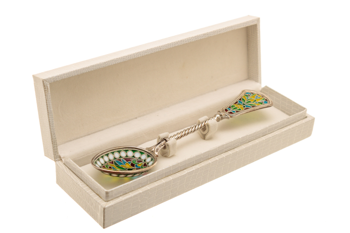 A teaspoon of "The Seasons. Summer" with stained glass enamels