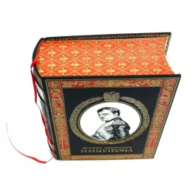The leather-bound book "The History of the Emperor Napoleon"