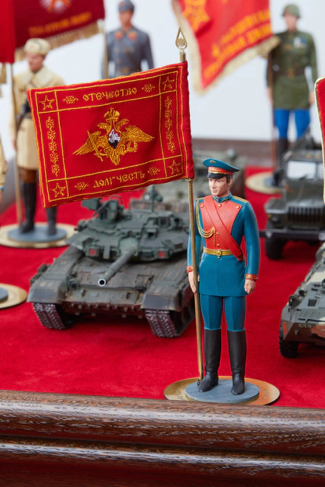 A book in a box with models of equipment and figures of military personnel "100 years of the Red Army"