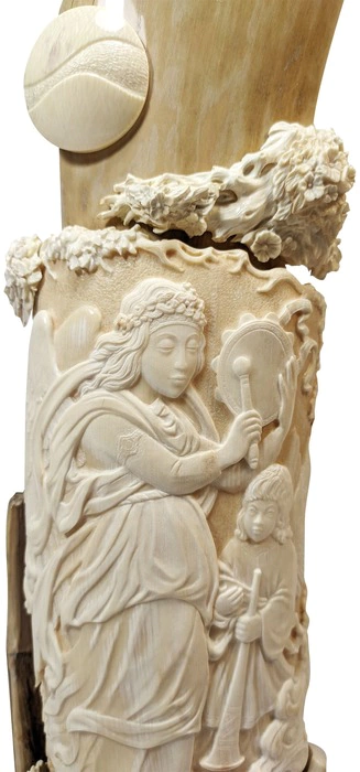 The composition of the mammoth tusk "Angels and the bird of Happiness"