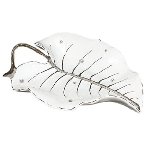 A dish in the shape of a leaf